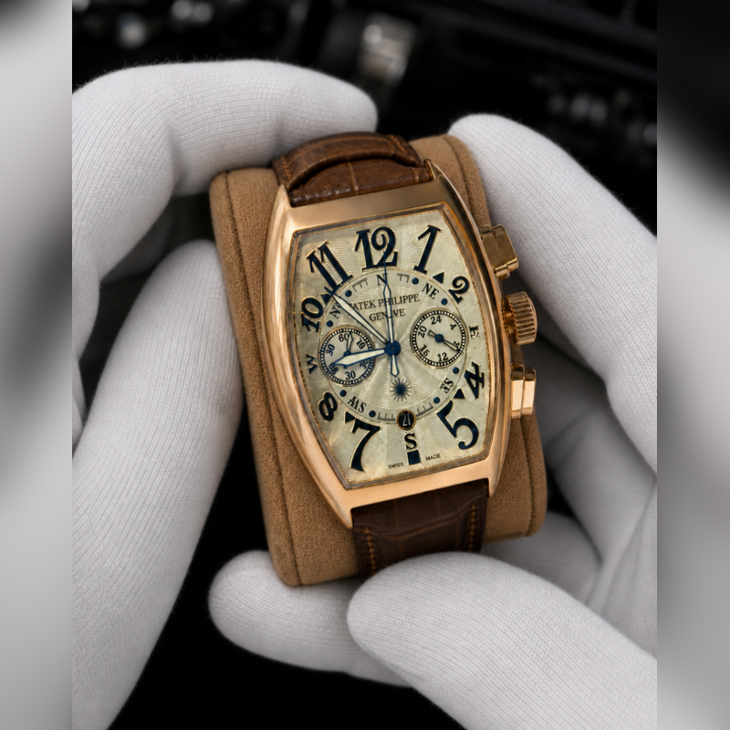 Patek Philippe style men's watch gold case brown leather strap close up
