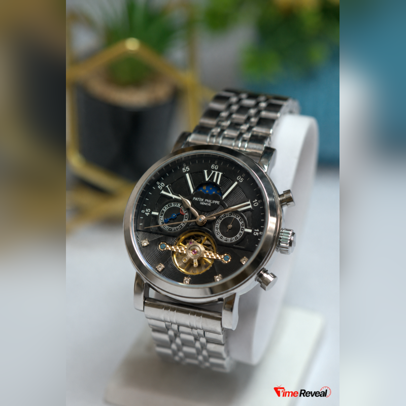 Patek Philippe black skeleton men's watch displayed on a premium watch stand