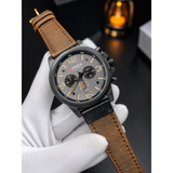 CURREN 8380 men's watch held in hand