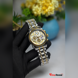 OLEVS 9947 white skeleton chronograph watch displayed on a white glove